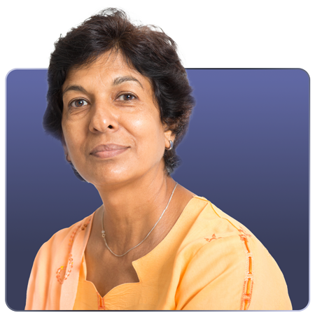 A middle-aged woman with short, dark hair wearing an orange blouse, looking directly at the camera against a gradient blue background.
