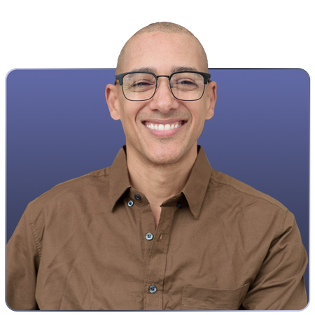 A smiling person with glasses, dressed in a brown shirt, set against a blue background.